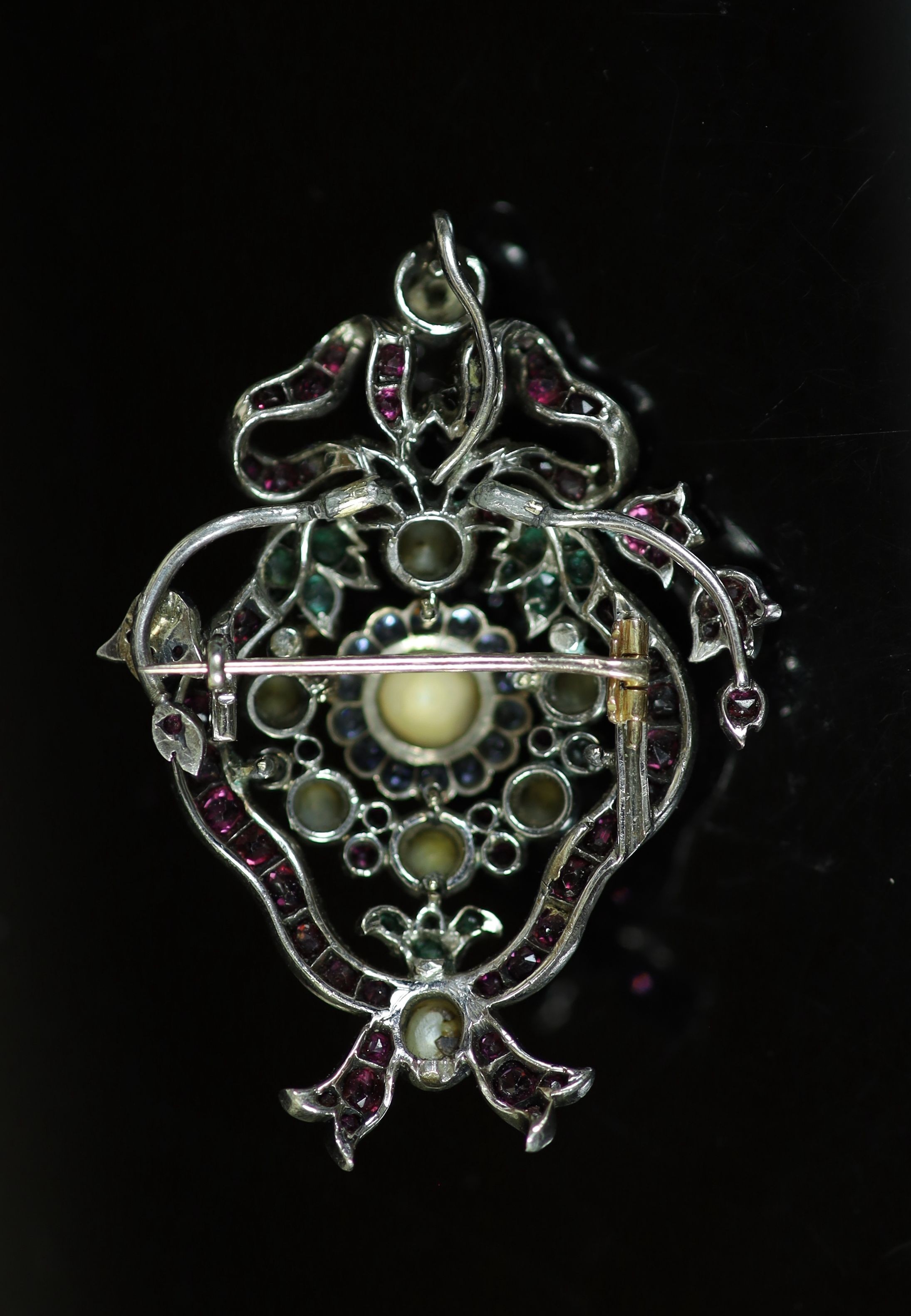 A 19th century Austro Hungarian silver and gold, ruby, sapphire, emerald and split pearl gem set pendant brooch